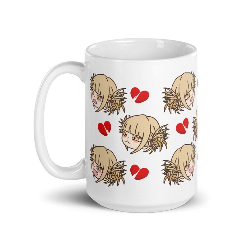 May include: White ceramic mug with a repeating pattern of a cartoon character with blonde hair and a red broken heart. The character has a frustrated expression.
