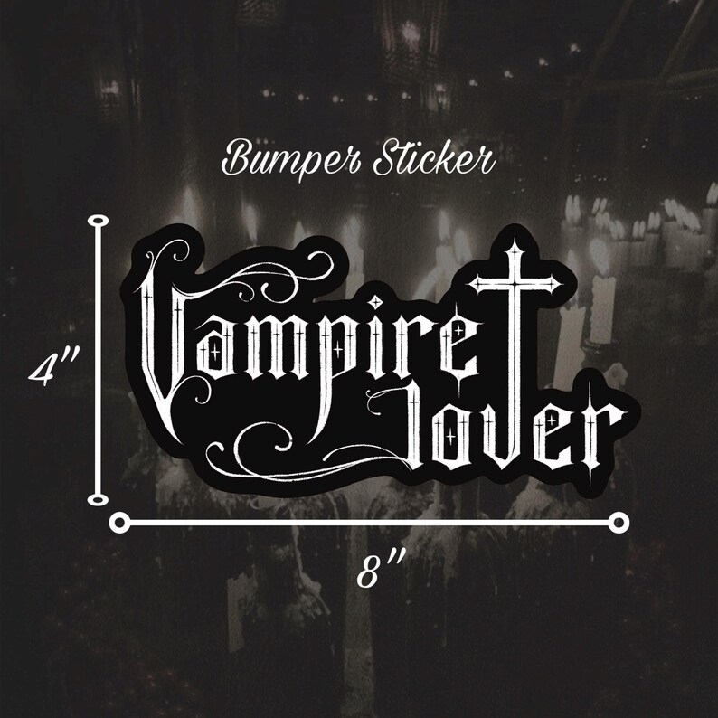 May include: Black bumper sticker with the words "Vampire Lover" in a gothic font, with a cross incorporated into the letter "T". The sticker is 8 inches wide and 4 inches tall.