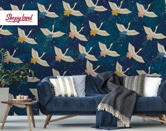 May include: A blue couch with white and gray striped pillows and a gray throw blanket in front of a wall with a navy blue and white crane pattern. The wall also has a white starry pattern. The text "Shoppy Land" is in the top left corner of the image.