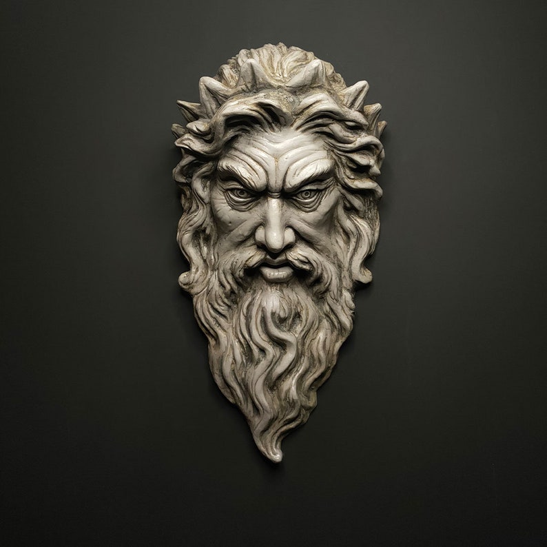 May include: A white plaster sculpture of a man's face with a beard and a crown of thorns. The sculpture is detailed and realistic.