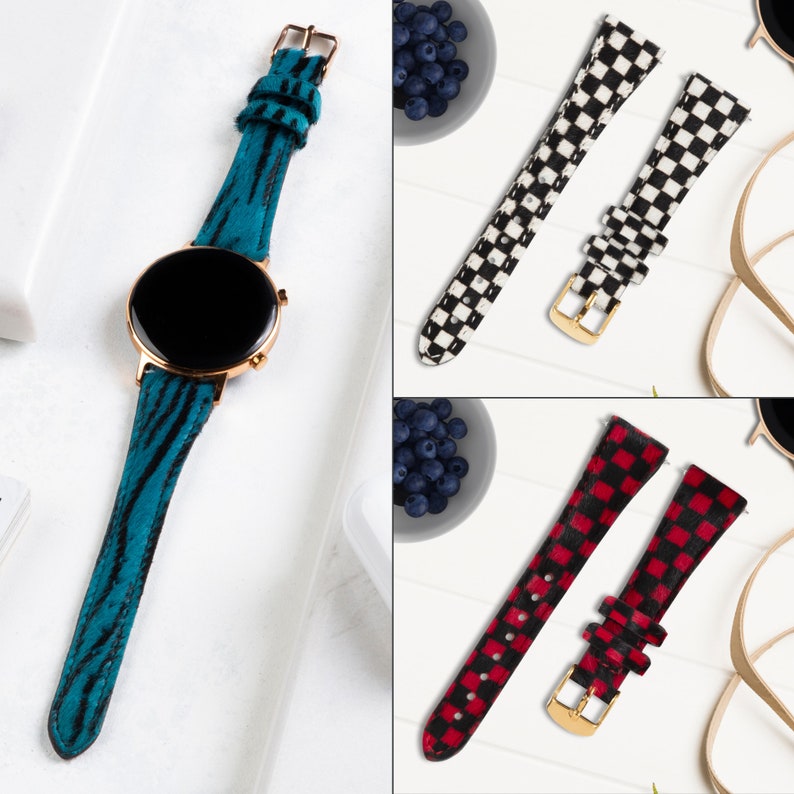 Puede incluir: Tres correas de reloj diferentes con patrones &uacute;nicos. La primera correa es azul con estampado de cebra, la segunda es a cuadros blanco y negro, y la tercera es a cuadros rojo y blanco.