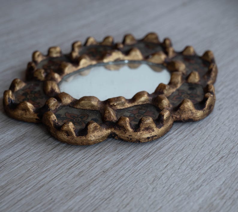 May include: A handmade, wooden serving tray with a natural finish. The tray features a rectangular shape with raised edges and integrated handles. The wood grain is visible, showcasing the tray's craftsmanship. Dimensions are approximately 16 inches long and 10 inches wide.