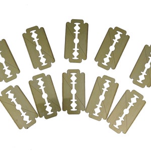 May include: Ten disposable double-edged razor blades with a gold finish.