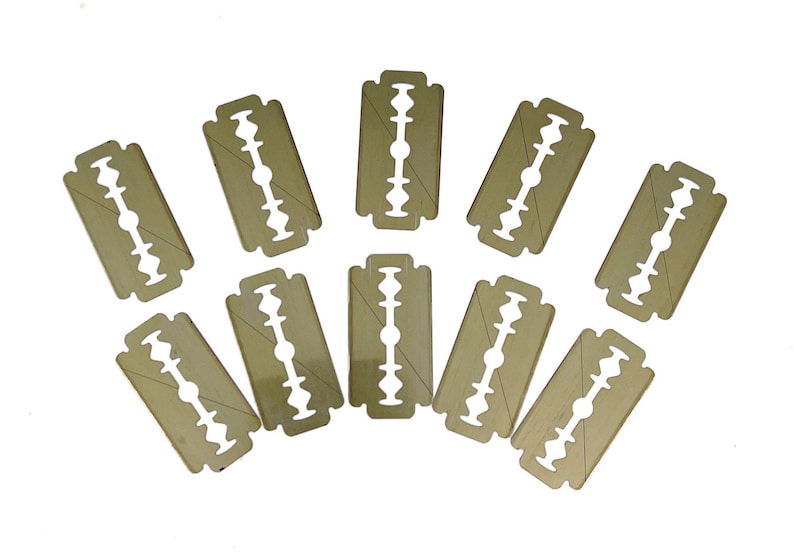 May include: Ten disposable double-edged razor blades with a gold finish.