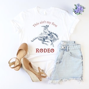 This Ain&#39;t My First Rodeo Shirt, Cowgirl Shirt, Western Shirt, Women Rodeo Shirt, Country Girl Shirt, Texas Rodeo Shirt, Country Music Shirt