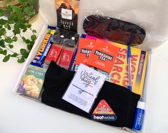 May include: A gift box filled with various items, including a chocolate bar, tea bags, a book, socks, a lip balm, and a bracelet. The box also includes a card that says "Virtual hug".