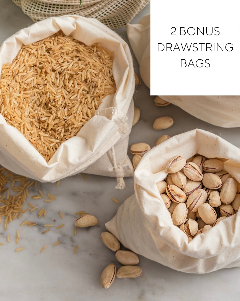 May include: Two white cotton drawstring bags, one filled with brown rice and the other with pistachios. The text "2 BONUS DRAWSTRING BAGS" is printed on a white rectangle.