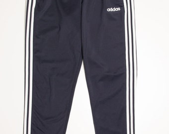 Pantalones deportivos cónicos Adidas de 3 rayas (talla M)