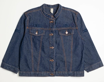 May include: A dark blue denim jacket with a mandarin collar and embroidered details. The jacket has a button closure and two front pockets.