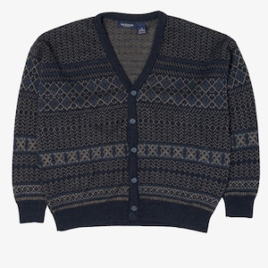 May include: A navy blue cardigan sweater with a V-neck and button closure. The sweater features a geometric pattern in shades of blue and tan. The garment is made of a soft, knitted material.
