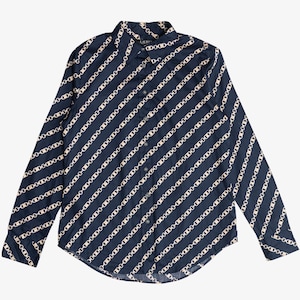 May include: Navy blue button-down shirt with a repeating chain link pattern in off-white. The long-sleeved shirt has a classic collar and buttoned cuffs. The chain link design is arranged in diagonal stripes.