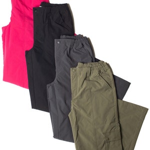 May include: Four pairs of pants in different colors: pink, black, gray, and green. The pants are all made of a lightweight fabric and have a casual style.