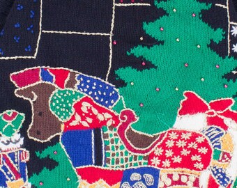 May include: A black knitted Christmas sweater with a colorful embroidered design featuring a Christmas tree, a reindeer pulling a sleigh, and a Santa Claus figure. The sweater has a festive and whimsical design.