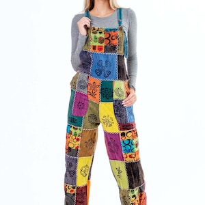 May include: A colourful patchwork jumpsuit with a variety of floral and geometric patterns. The jumpsuit has a relaxed fit and wide legs.