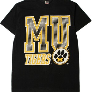 May include: Black t-shirt with a yellow and white "MU Tigers" graphic and a paw print with an "M" inside.