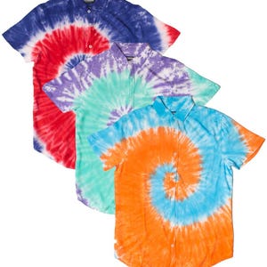 May include: Four short-sleeved button-down shirts with a tie-dye spiral pattern. The shirts are in shades of blue, red, purple, green, and orange. The shirts are made of a lightweight fabric.