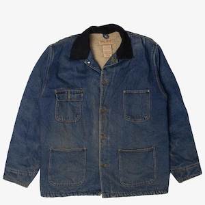 May include: A vintage blue denim jacket with a black corduroy collar. The jacket has four front pockets and a button-up closure. The collar has a Big Mac tag. This workwear-style jacket is a classic.