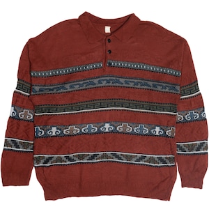 May include: A rust-colored knit sweater with a polo collar and three buttons. The sweater features horizontal bands of patterned designs in shades of blue, gray, and brown. The long-sleeved sweater has a ribbed hem and cuffs.