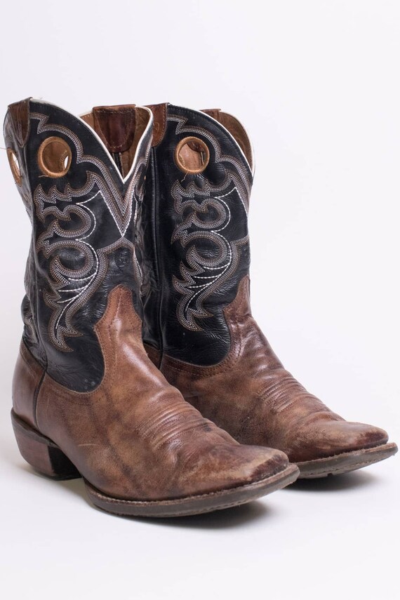 brown and black cowboy boots