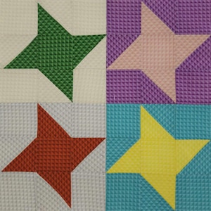 May include: A patchwork quilt with four squares, each featuring a different colored star. The top left square has a green star, the top right square has a pink star, the bottom left square has a red star, and the bottom right square has a yellow star.