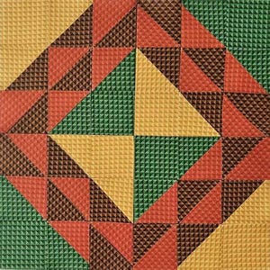 May include: A geometric pattern made of triangles in shades of green, brown, orange, and yellow. The triangles are arranged in a repeating pattern, creating a visually appealing design.