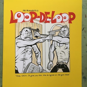 May include: A yellow comic book cover with the title "Loop-De-Loop" in red letters. The cover features a black and white illustration of two men in a room, one pointing a gun at the other's head. The caption reads "Okay, OKAY. I'll give you that. We do agree on the gun issue."