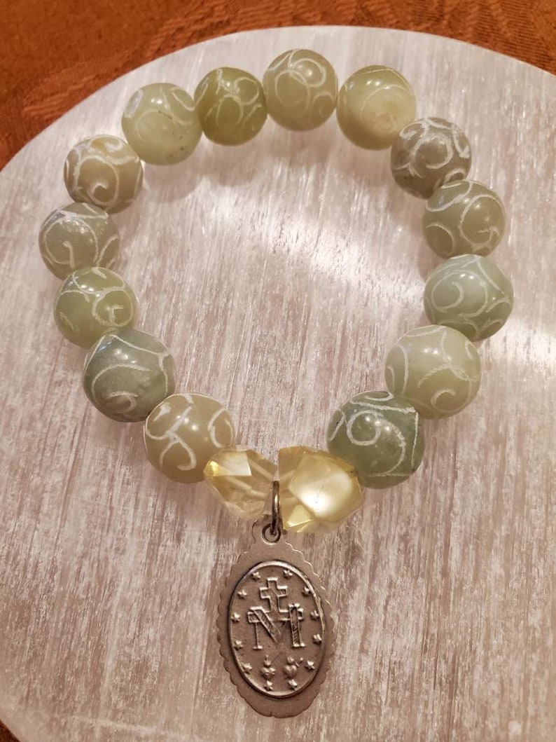 Carved Jade beads and Lemon Quartz Mother Mary bracelet.