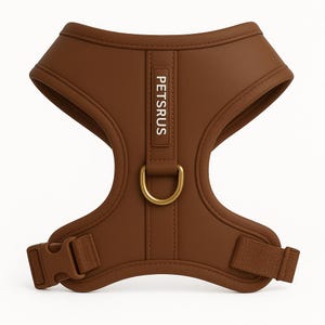 PETsRUS premium bronze brown dog harness with rich gold D-ring hardware and stylish earthy tone. No-pull design with soft neoprene padding and breathable mesh interior for small to medium dogs. Includes adjustable neck and chest straps for a secure custom fit. Ideal for puppy training, everyday walks, and travel. Sleek, padded, and lightweight luxury vest harness built for style, safety, and comfort on the go.