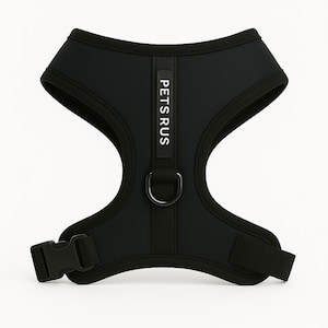 Sleek black neoprene dog harness in charcoal shade by PETsRUS. Features matching black hardware, breathable mesh lining, and dual adjustable straps for a perfect fit. No-pull dual clip design supports leash training and comfortable walking. Durable and stylish, ideal for urban pups or minimalistic pet owners. Great for small and medium breeds. Secure vest-style harness with quick-release buckle and soft padded support.