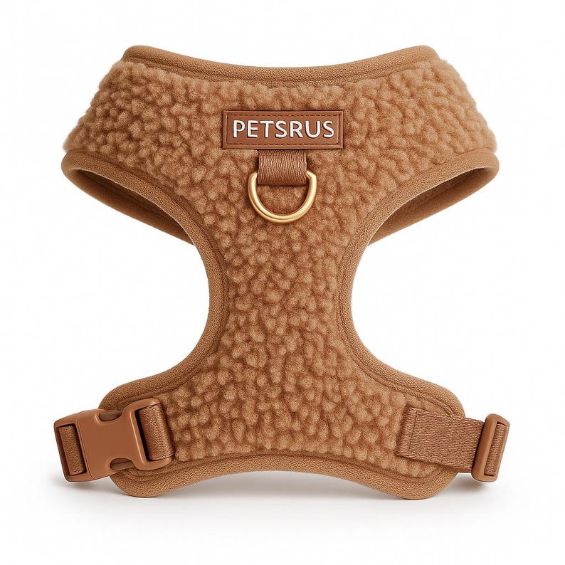 Teddy-style light brown sherpa dog harness by PETsRUS with luxurious gold hardware. Ultra-soft, plush fleece no-pull vest design keeps dogs cozy and secure during walks. Features adjustable straps at neck and chest for a perfect fit. Includes front and back D-ring leash clips for gentle control and training. Easy to wear and remove with quick-release buckle. Ideal for small, medium, and large dogs. A stylish, warm, and functional dog harness for daily comfort and control.