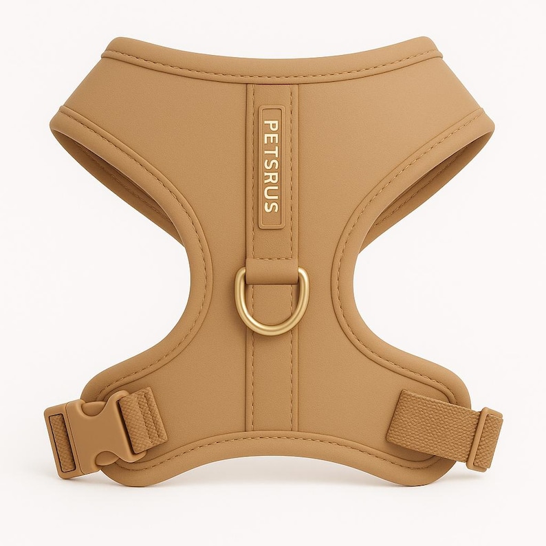 Luxurious beige dog harness from PETsRUS featuring elegant rose gold hardware. This adjustable no-pull harness is made with soft neoprene and breathable mesh lining for ultimate comfort. Designed for small and medium dogs, it offers front and back D-rings, easy side buckle, and stylish neutral tones. Ideal for fashionable daily walks, puppy training, and secure outdoor adventures. Custom fit for all-day wear.
