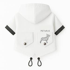 May include: White hooded raincoat with black trim and a geometric dog design on the back. The raincoat has a pocket on each side and says "PETSRUS" on the back.