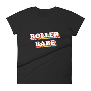 May include: Black women's t-shirt with the text "ROLLER BABE" in rainbow colors.