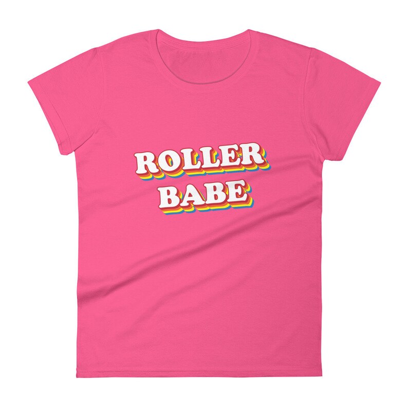 May include: Pink women's t-shirt with the text "ROLLER BABE" in rainbow letters.
