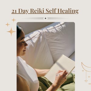 May include: A person writing in a notebook, with the text "21 Day Reiki Self Healing" at the top. The image has a neutral colour palette with gold accents, including star and moon illustrations.
