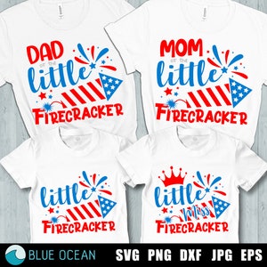 May include: Four white t-shirts with red, white, and blue text and graphics. The shirts say "Dad of the little firecracker", "Mom of the little firecracker", "little firecracker", and "little miss firecracker".