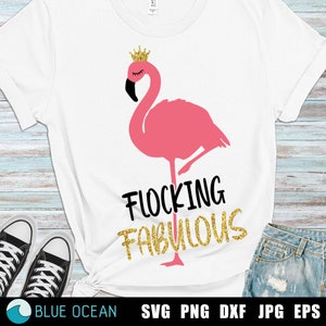 May include: A white t-shirt with a pink flamingo wearing a gold crown. The flamingo is standing on one leg and the text "Flocking Fabulous" is written below it in black and gold glitter.