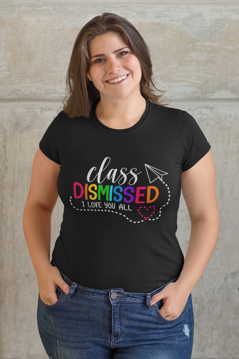 May include: Black t-shirt with the text "class DISMISSED I love you all" in rainbow colours with a paper aeroplane and a heart.