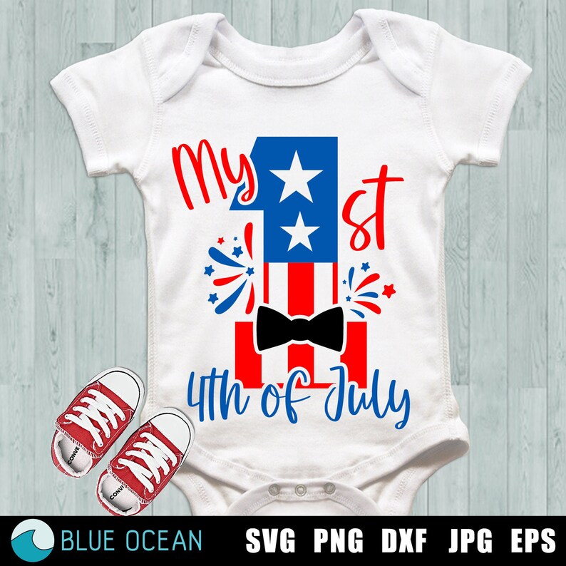 May include: White baby onesie with a red, white, and blue American flag design. The onesie has the text "My 1st 4th of July" with a bow tie on the flag.