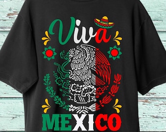 May include: Black t-shirt with a white "Viva Mexico" design featuring a green, white, and red Mexican flag with a stylized eagle and a sombrero.