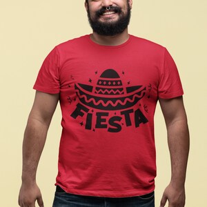 May include: A red t-shirt with a black graphic of a sombrero and the word "FIESTA" printed on the front.
