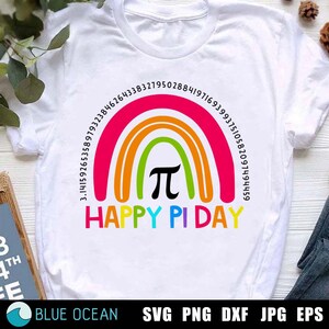 May include: White t-shirt featuring a rainbow design with the pi symbol and digits of pi. The text "HAPPY PI DAY" is below the rainbow. A colourful and fun t-shirt to celebrate Pi Day.