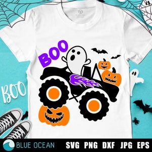 May include: White t-shirt with a Halloween-themed graphic. The design features a black monster truck with orange wheels, a ghost, and the word "BOO" in purple. Includes orange jack-o'-lanterns and black bats.