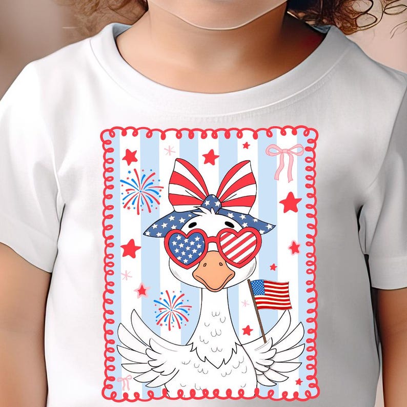 May include: White t-shirt with a cartoon goose wearing red, white, and blue sunglasses and a bow. The goose is holding an American flag. The background is blue and white stripes with stars and fireworks.