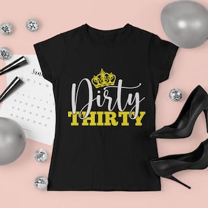May include: Black t-shirt with a gold crown and the text "Dirty Thirty" in white and yellow.