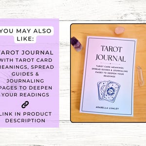 May include: A tarot journal titled "Tarot Journal" with the author's name, Arabella Lumley, on the cover. The cover also includes the text "Tarot Card Meanings, Spread Guides & Journaling Pages to Deepen Your Readings". The journal is on a wooden surface.