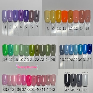 May include: A color chart with 47 different nail polish colors. The colors are arranged in rows and numbered 1 through 47. The colors include shades of purple, yellow, green, blue, pink, and gray.