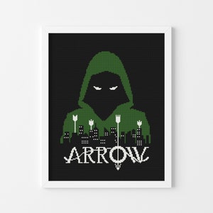 May include: Green hooded figure with a city skyline and arrows behind them. The text "ARROW" is below the figure.