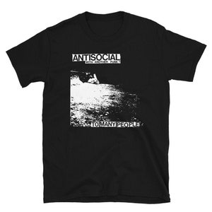 May include: Black t-shirt with white text that reads "ANTISOCIAL WITH ANOTHER PUNK?" and "TO MANY PEOPLE".
