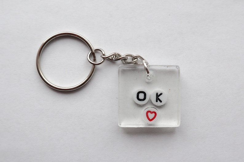 Ok 100/% handmade and made to order this adorable keychain is perfect for any quirky fun key or purse nont This item is made from clear